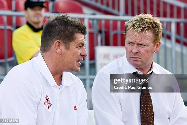 Head coach John Carver and manager Mo Johnston of Toronto FC discuss strategy before the match against Independiente on July 15, 2008 at BMO Field in...