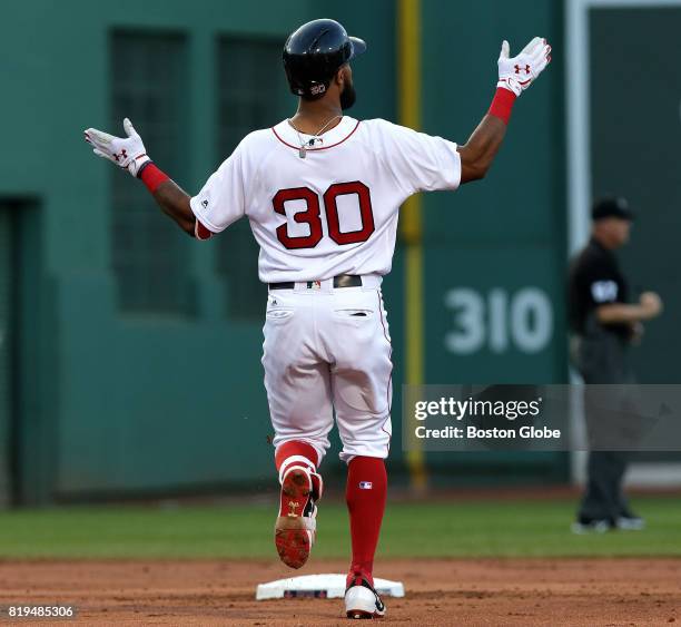 Boston Red Sox left fielder Chris Young claps his hands after his leadoff double in the second inning. The Boston Red Sox host the Toronto Blue Jays...