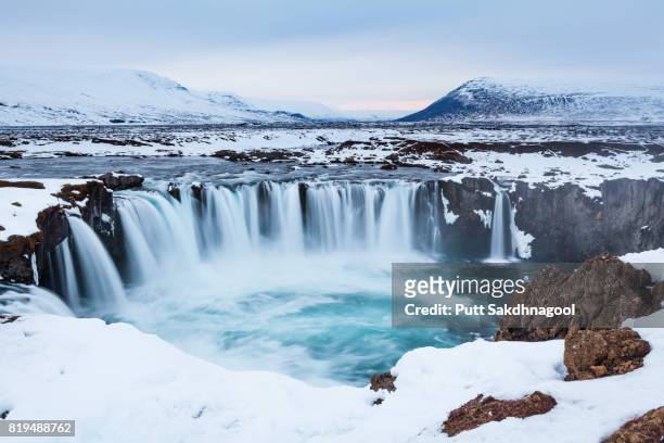 godafoss fall during sunset in winter, iceland - iceland waterfall stock-fotos und bilder