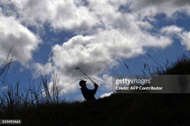 Golfer Jimmy Walker plays from the 4th tee during his opening round on the first day of the Open Golf Championship at Royal Birkdale golf course near...