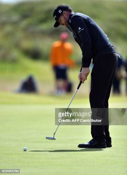 Golfer Jimmy Walker putts on the 4th green during his opening round on the first day of the Open Golf Championship at Royal Birkdale golf course near...