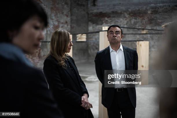 Carlos Ghosn, chairman of Renault SAS, Nissan Motor Co., and Mitsubishi Motors Corp., views artwork at the DIA Art Foundation in the Chelsea...