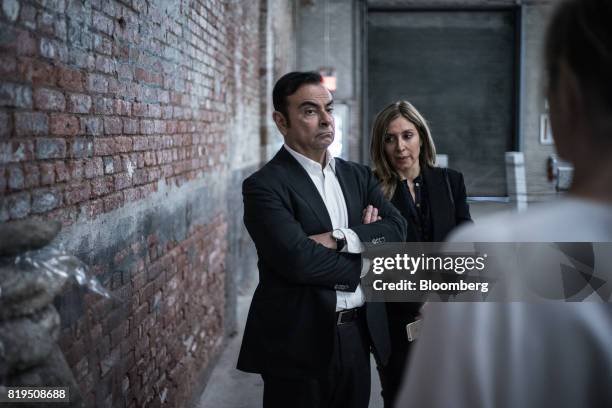 Carlos Ghosn, chairman of Renault SAS, Nissan Motor Co., and Mitsubishi Motors Corp., left, and his wife Carole Nahas view artwork at the DIA Art...