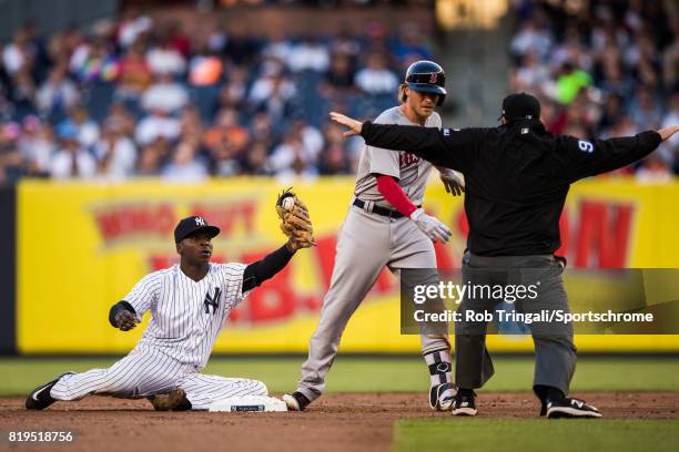 Josh Rutledge the Boston Red Sox slides safely before the tag by Didi Gregorius of the New York Yankees during the game against the New York Yankees...