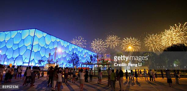 Fireworks explode over the National Stadium, known as Bird's Nest near the National Aquatics Centre, known as the Water Cube during a rehearsal for...