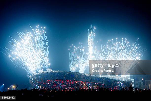 Fireworks explode over the National Stadium, known as Bird's Nest during a rehearsal for the opening ceremony of the 2008 Beijing Olympic Games on...