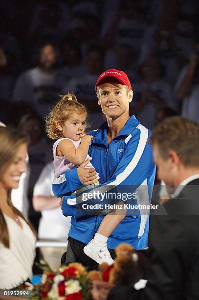 Olympic Trials: Dara Torres victorious, holding daughter Tessa during awards ceremony at Qwest Center. Omaha, NE 7/4/2008 CREDIT: Heinz Kluetmeier