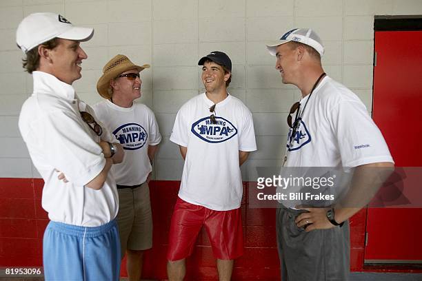Manning Passing Academy: Cooper Manning, Archie Manning, New York Giants QB Eli Manning, and Indianapolis Colts QB Peyton Manning during camp on...