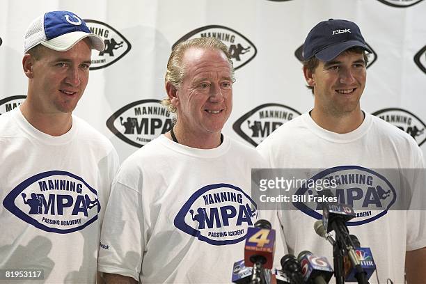 Manning Passing Academy: Closeup of Indianapolis Colts QB Peyton Manning, Archie Manning, and New York Giants QB Eli Manning during media press...