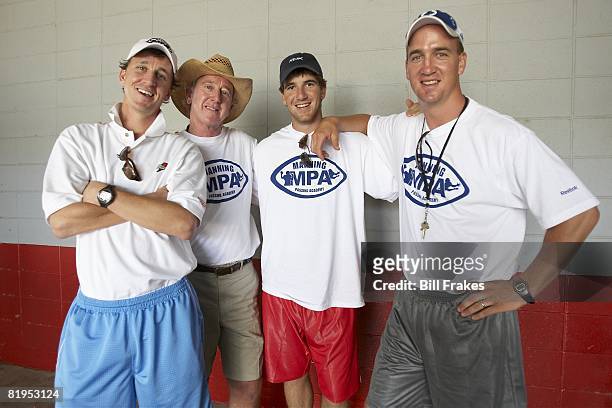 Manning Passing Academy: Cooper Manning, Archie Manning, New York Giants QB Eli Manning, and Indianapolis Colts QB Peyton Manning during camp on...