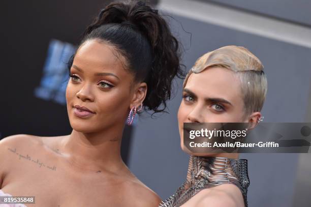 Singer/actress Rihanna and model/actress Cara Delevingne arrive at the Los Angeles premiere of 'Valerian and the City of a Thousand Planets' at TCL...