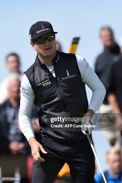 Golfer Zach Johnson watches his iron shot from the 9th tee during his opening round on the first day of the Open Golf Championship at Royal Birkdale...