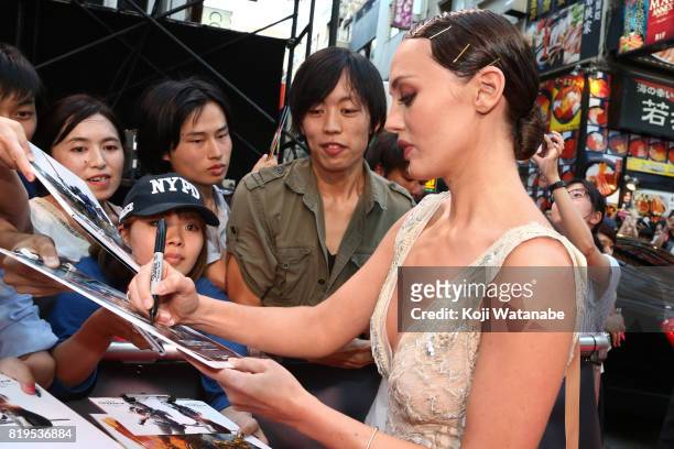 Laura Haddock signs autograph for fans at the Japanese premiere of "Transformers: The Last Knight" at TOHO Cinemas Shinjuku on July 20, 2017 in...
