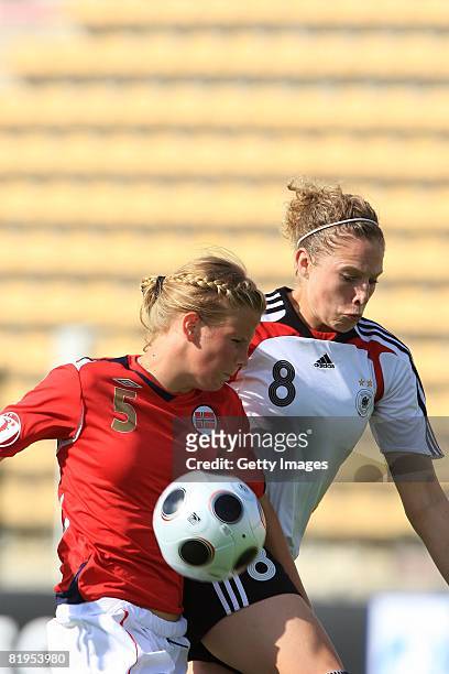 Gunhild Herregarden of Norway and Kim Kulig of Germany fight for the ball during the Women's U19 European Championship match between Germany and...