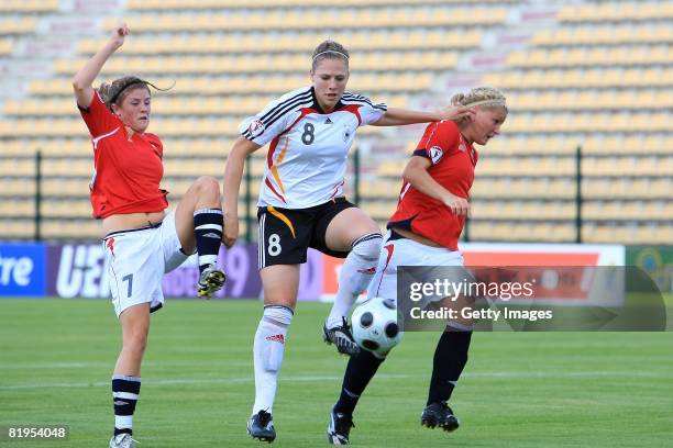 Kim Kulig of Germany between Maren Mjelde and Gunhild Herregarden of Norway during the Women's U19 European Championship match between Germany and...