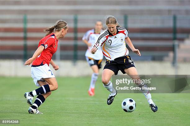 Grotta Astrid Ree of Norway and Marie Pollmann of Germany fight for the ball during the Women's U19 European Championship match between Germany and...