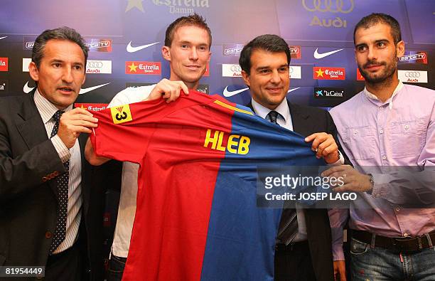 Barcelona's technical director Txiki Begiristain, Belarus international midfielder Alexander Hleb,the club's president Joan Laporta and coach Pep...