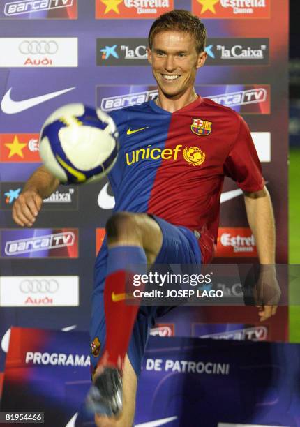 Barcelona's new player Belarus international midfielder Alexander Hleb plays with a ball on July 16, 2008 at the Nou Camp stadium in Barcelona during...