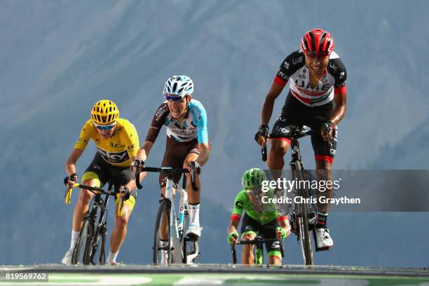 Jhon Darwin Atapuma Hurtado of Colombia riding for UAE Team Emirates leads Romain Bardet of France riding for AG2R La Mondiale and Christopher Froome...