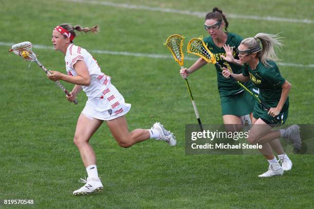 Katie Guy of Canada escapes from Sarah Mollison and Abbie Burgess of Australia during the semi-final match between Australia and Canada during the...