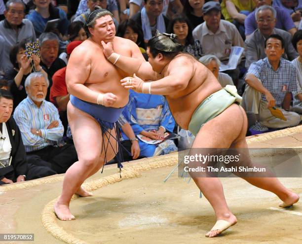 Ozeki Takayasu pushes Shodai out of the ring to win during day seven of the Grand Sumo Nagoya Torunament at Aichi Prefecture Gymnasium on July 15,...