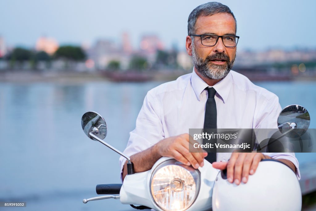 Mature Business Man On Scooter