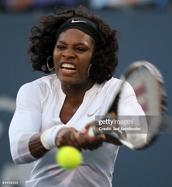 Serena Williams returns a shot against Michelle Larcher De Brito of Portugal during the Bank of the West Classic Day 3 at Stanford University July...