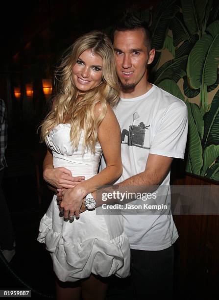 Model Marisa Miller and Griffin Guess attend an Evening Celebrating Vans by Marisa Miller at The Cabanas at the Maritime Hotel on July 16, 2008 in...