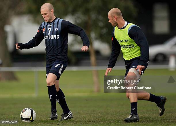 Matthew Kemp of the Victory is pressured by his teammate Sebastian Ryall during the Melbourne Victory A-League training session at Gosch`s Paddock on...