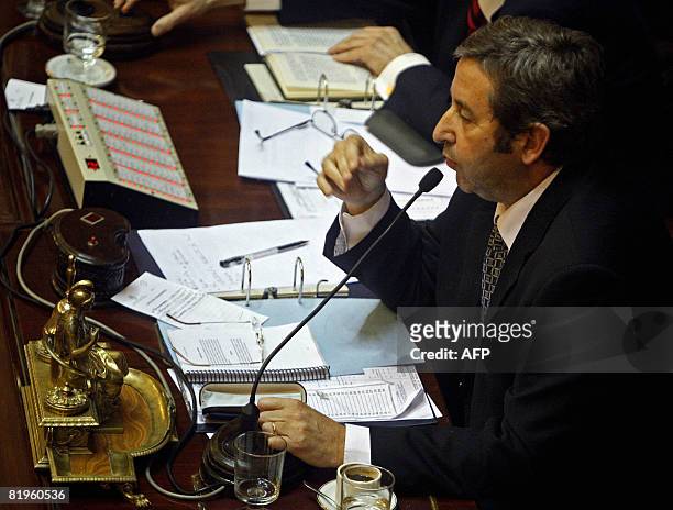 Argentina's upper house's president, Julio Cobos, delivers a speech and gives his vote against the government grain tax bill at the end of a debate...