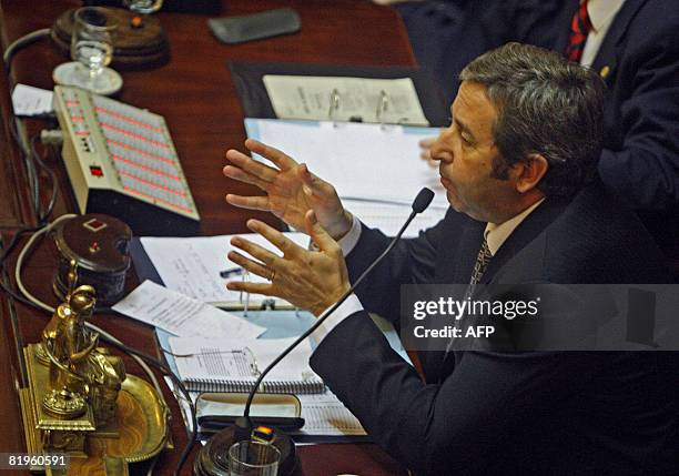 Argentina's upper house's president, Julio Cobos, gives his vote against the government grain tax bill at the end of a debate to approve in Buenos...