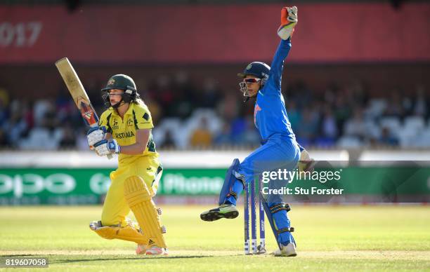 Australia batsman Ellyse Perry hits out watched by India wicketkeeper Sushma Verma during the ICC Women's World Cup 2017 Semi-Final match between...