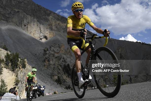 Great Britain's Christopher Froome , wearing the overall leader's yellow jersey, rides ahead of Colombia's Rigoberto Uran during the 179,5 km...