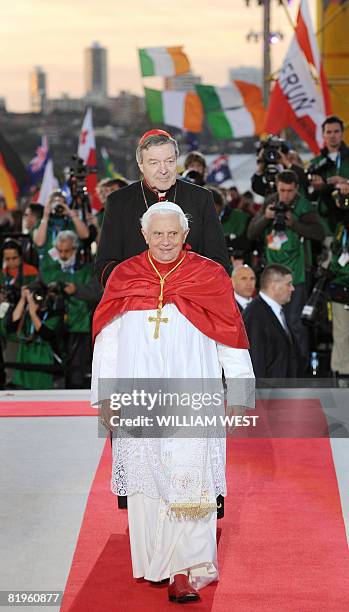 Pope Benedict XVI is followed by Cardinal George Pell after addressing the massive crowd at World Youth Day festivities in Sydney on July 17, 2008....