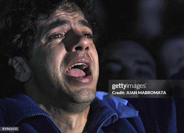 Farmer cries while singing the country's national anthem after senators voted to reject a pro-government grain tax bill on July 17, 2008 in Buenos...