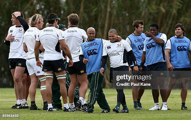 Bolla Conradie and Ricky Januarie of the Springboks walk up the field during the South Africa Springboks Training Session at Tompkins Park on July...