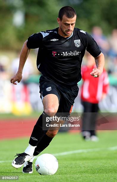 Neil Clement of West Bromwich Albion runs with the ball during a pre season friendly match between Borussia Moenchengladbach and West Bromwich Albion...