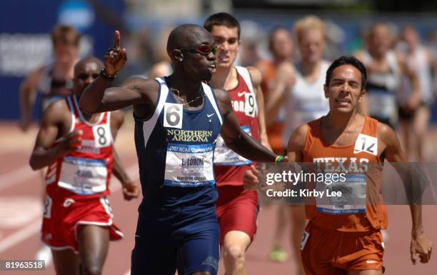 Lopez Lomong of Northern Arizona celebrates after holding off Leonel Manzano of Texas to win the 1,500 meters, 3:37.07 to 3:37.48, in the NCAA Track...