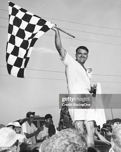 Fonty Flock, wearing Bermuda short pants and a short-sleeve shirt, won the 3rd annual Southern 500 at Darlington in 1952. He took the lead just...