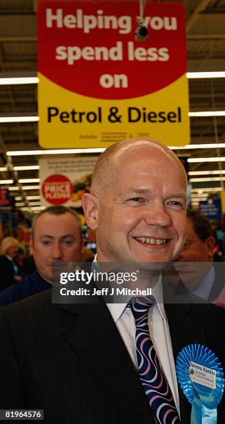 Shadow Foreign Secretary William Hague smiles during a visit to Tesco in Shettleston as he supports Davina Rankin the Conservative Party candidate in...