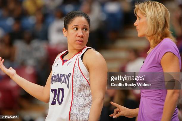 Kara Lawson and Head Coach Jenny Boucek of the Sacramento Monarchs discuss a play during the WNBA game against the Los Angeles Sparks on July 10,...