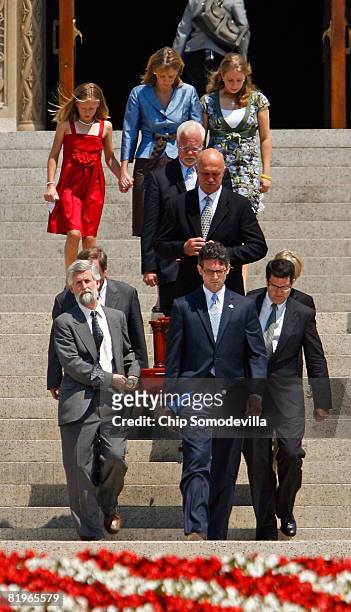 Pallbearers carry former White House Press Secretary Tony Snow's remains out of the Basilica of the National Shrine of the Immaculate Conception...