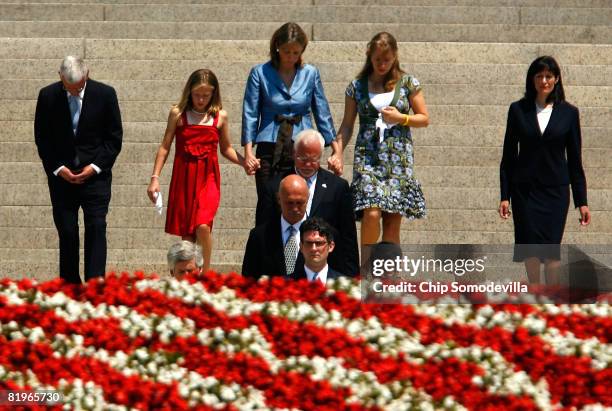 Pallbearers carry former White House Press Secretary Tony Snow's remains out of the Basilica of the National Shrine of the Immaculate Conception...