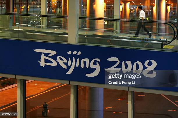 Person walks into the Beijing International Airport on July 17, 2008 in Beijing, China. China has tightened security for the Olympics in August.