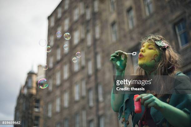 fairy performer blowing bubbles - theasis stock pictures, royalty-free photos & images