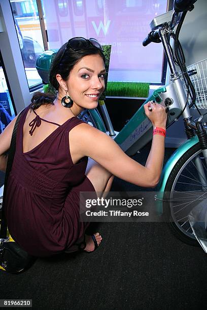 Model Adrienne Curry autographs a green bike at Melanie Segal's Hollywood Platinum Lounge for the MTV Movie Awards Day One at The W Hotel on May 29,...