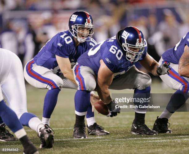 New York Giants quarterback Eli Manning takes the snap from New York Giants center Shaun O'Hara. The Indianapolis Colts beat the New York Giants by a...