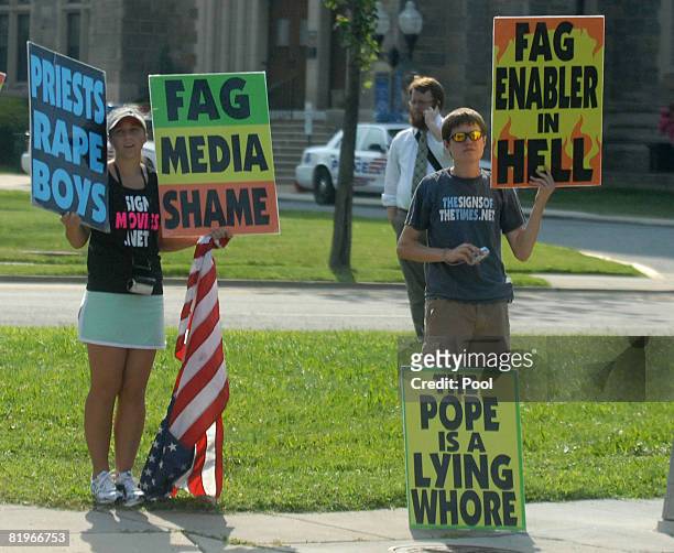 Members of the Westboro Baptist Church protest near the National Shrine of the Immaculate Conception where the funeral service for former White House...