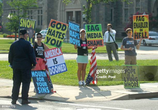 Members of the Westboro Baptist Church protest near the National Shrine of the Immaculate Conception where the funeral service for former White House...