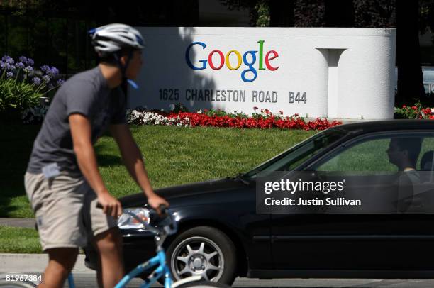 Bicyclist rides by a sign outside of the Google headquarters July 17, 2008 in Mountain View, California. Google Inc. Is expected to announce an...